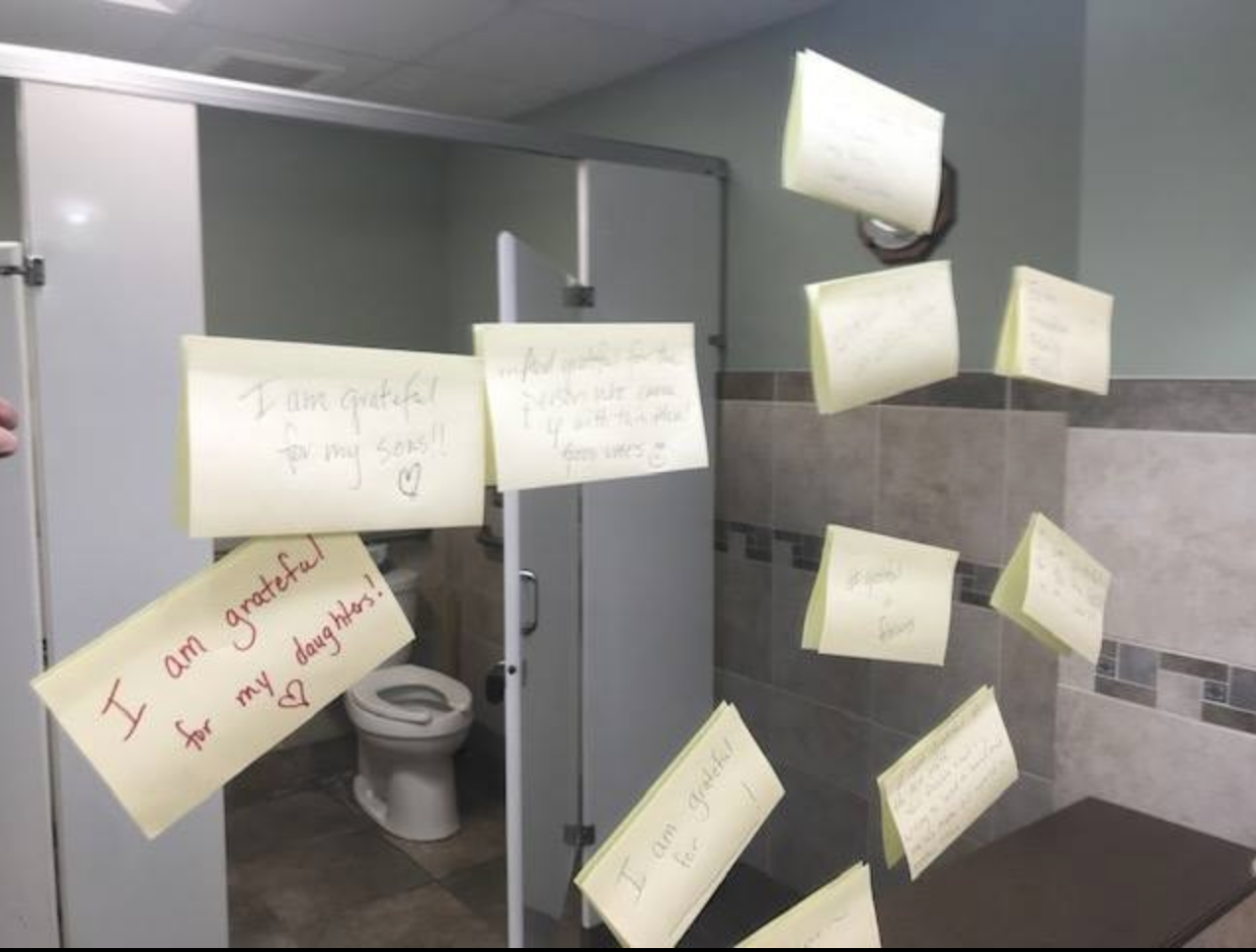Sticky notes attached to a mirror in the Clear Lake office.