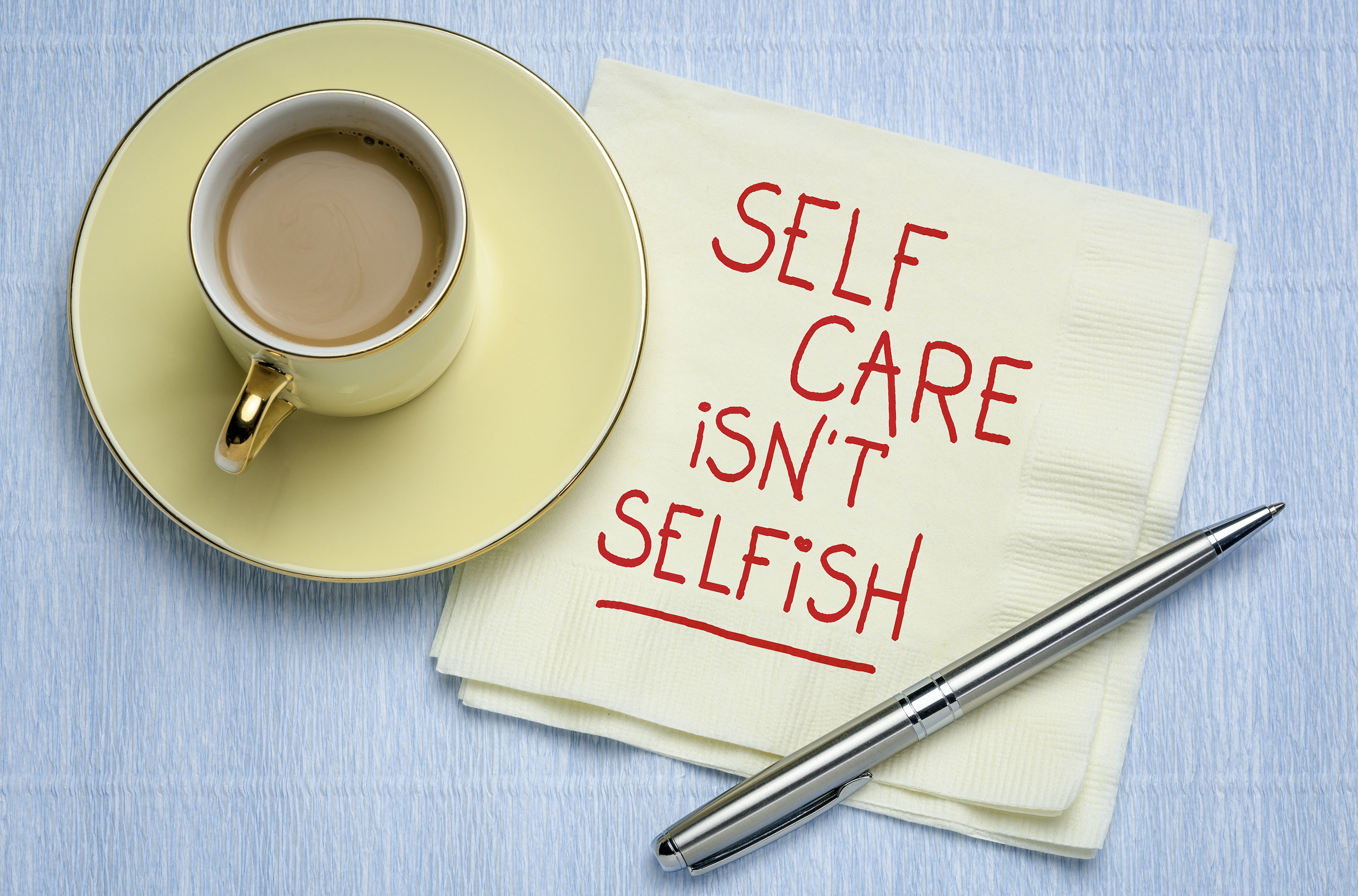 Photo of coffee cup and the words self care isn't selfish