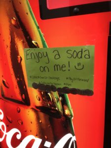 Own it sign close up on pop machine
